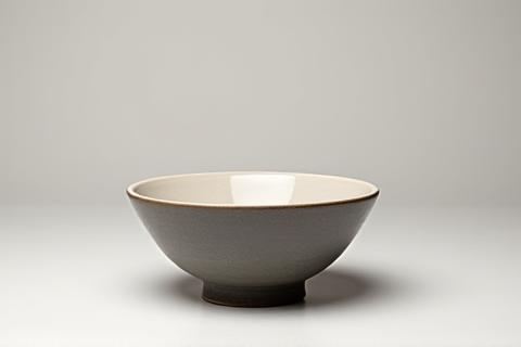 Close-up of a meticulously photographed ceramic vase showcasing texture